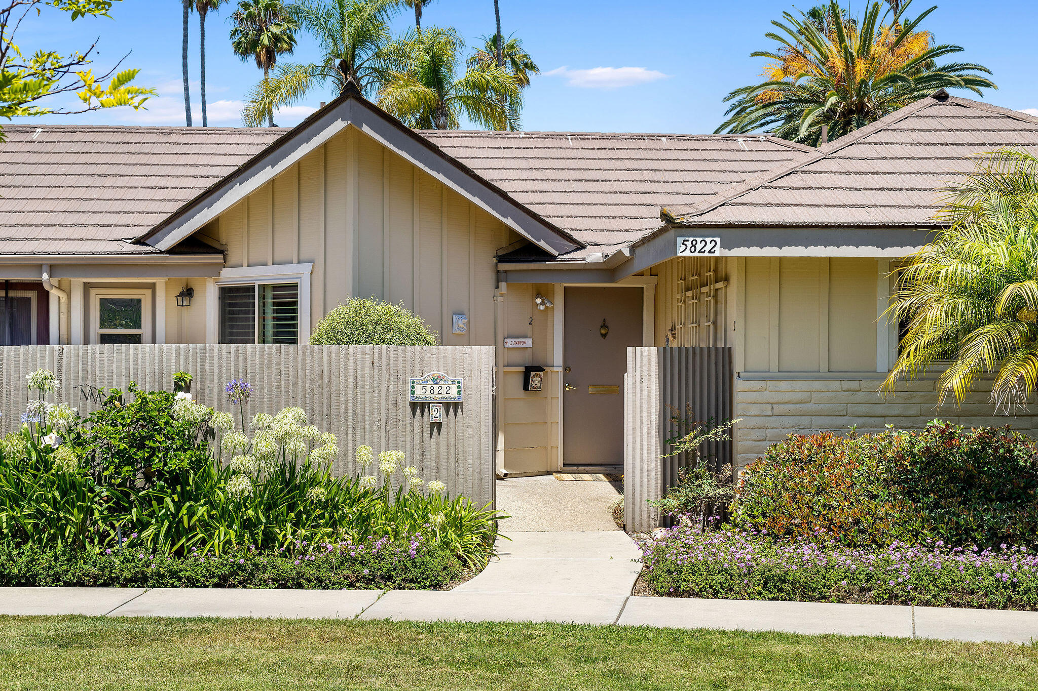 front view of a house with a yard