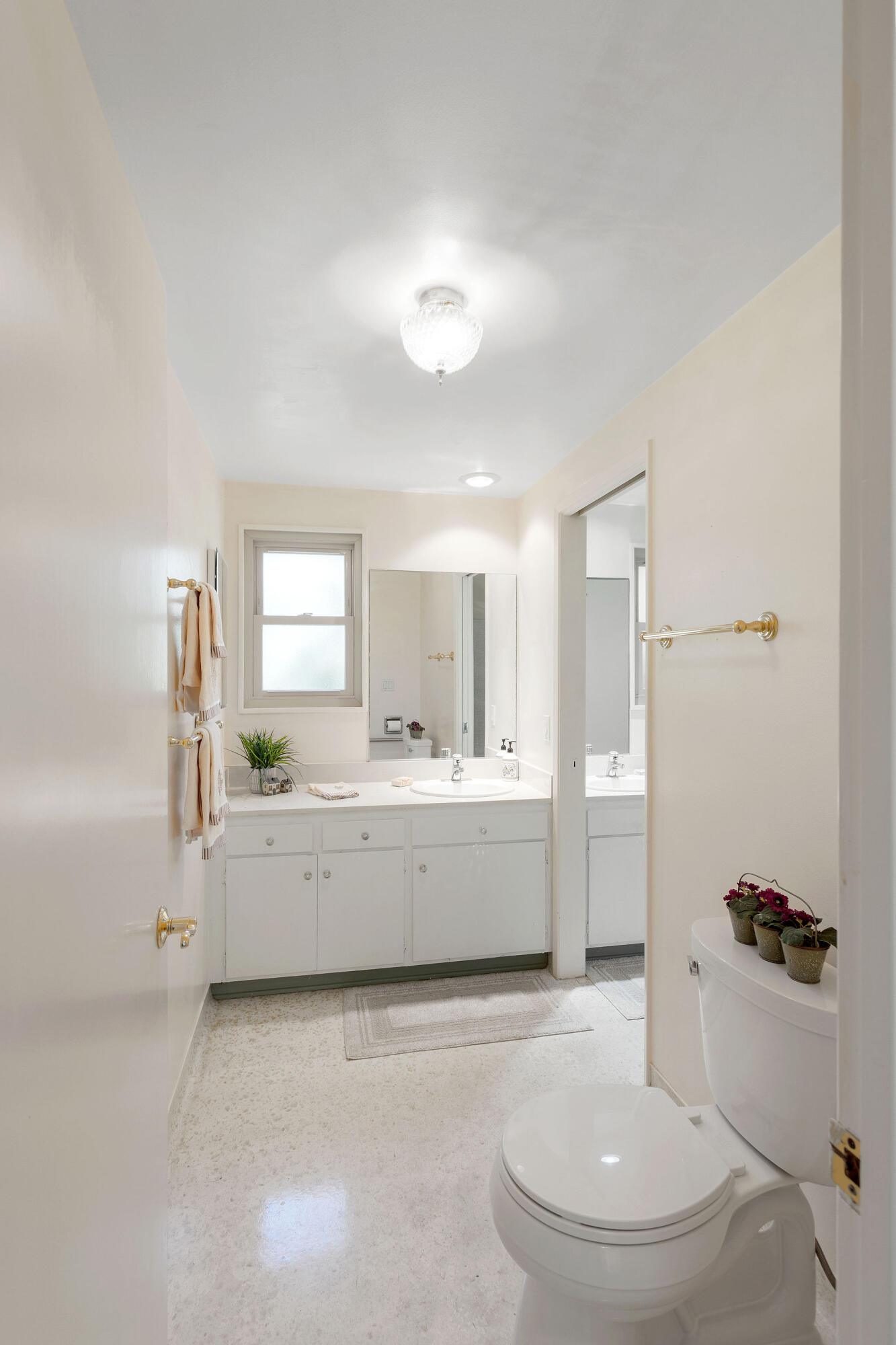5822 Encina Road, Unit 2 Santa Barbara, CA 93117 - Photo 14 of 42 a bathroom with a granite countertop sink mirror bathtub and toilet
