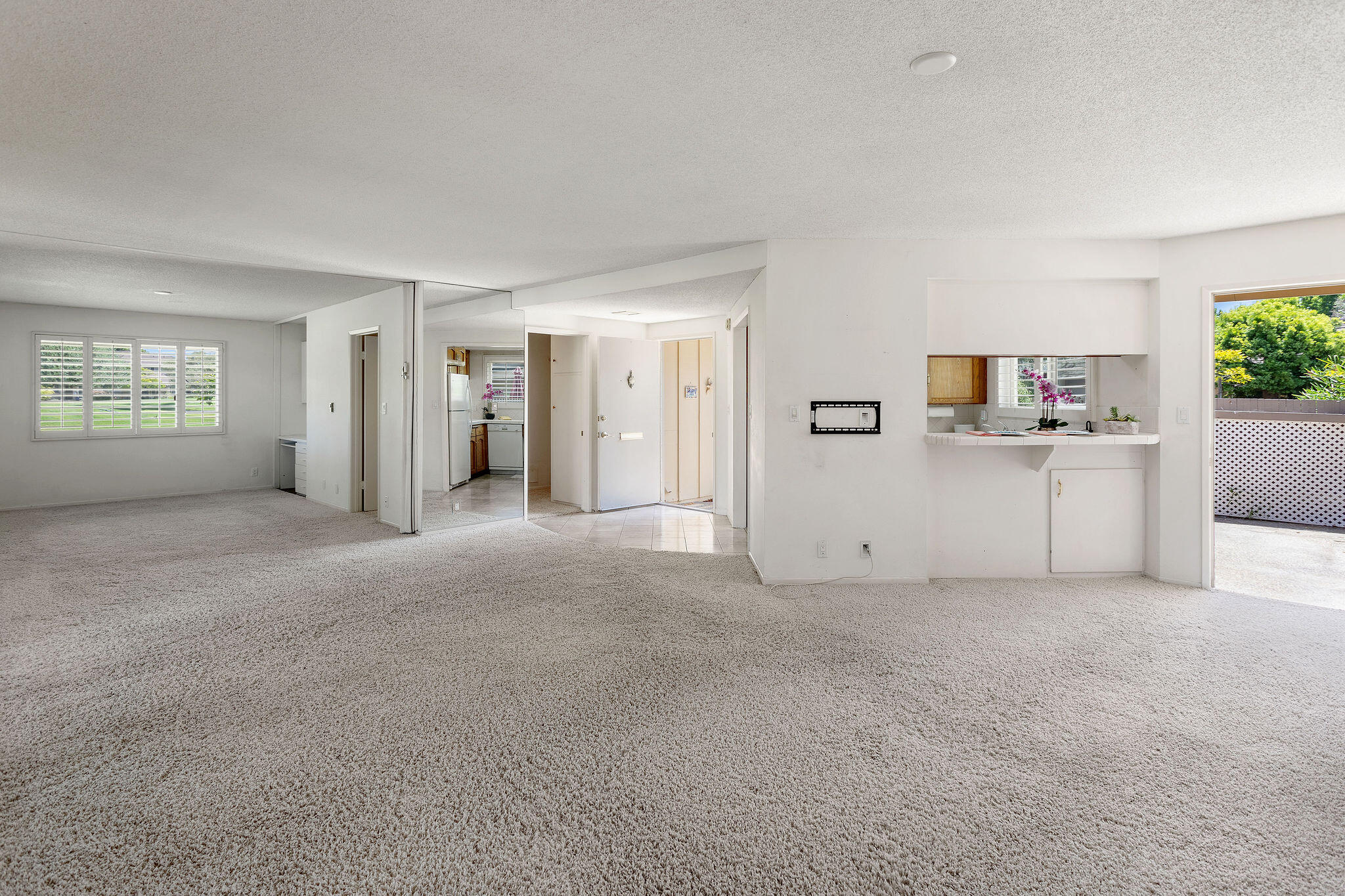 5822 Encina Road, Unit 2 Santa Barbara, CA 93117 - Photo 2 of 42 a view of a big room with windows and cabinet