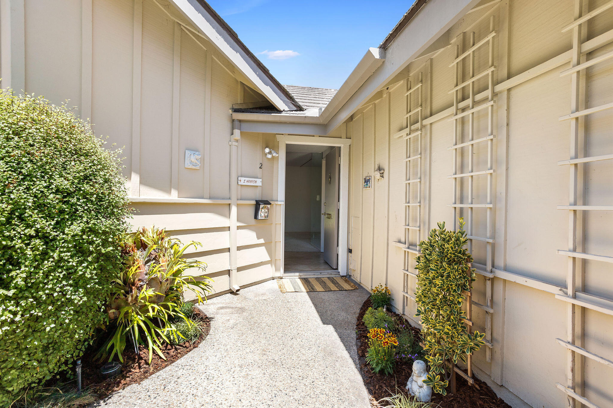 5822 Encina Road, Unit 2 Santa Barbara, CA 93117 - Photo 25 of 42 a front view of a house with a garden