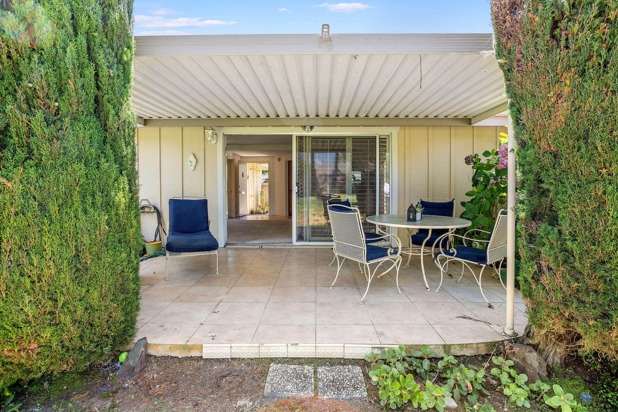 5822 Encina Road, Unit 2 Santa Barbara, CA 93117 - Photo 29 of 42 a view of a patio with table and chairs and potted plants