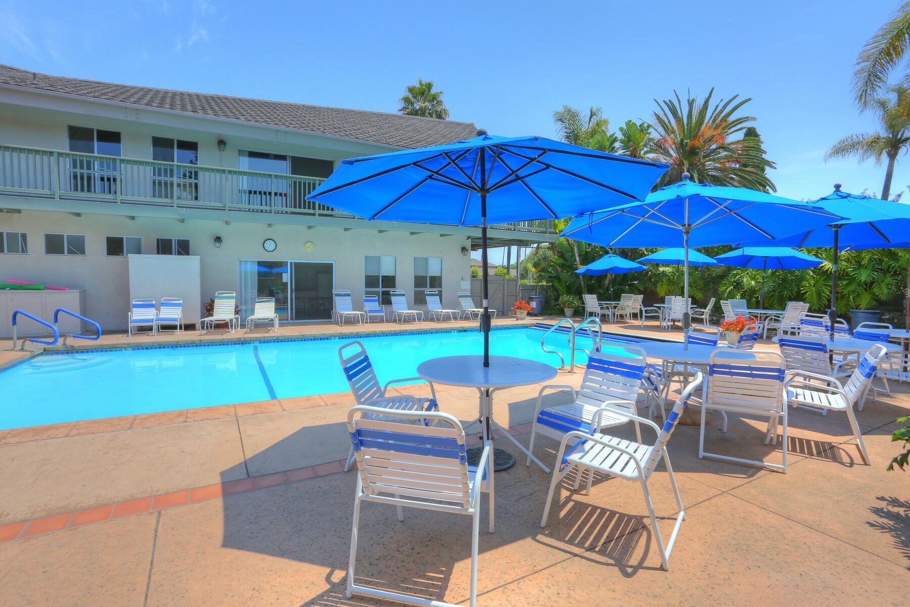 5822 Encina Road, Unit 2 Santa Barbara, CA 93117 - Photo 39 of 42 a patio with a table and chairs under an umbrella
