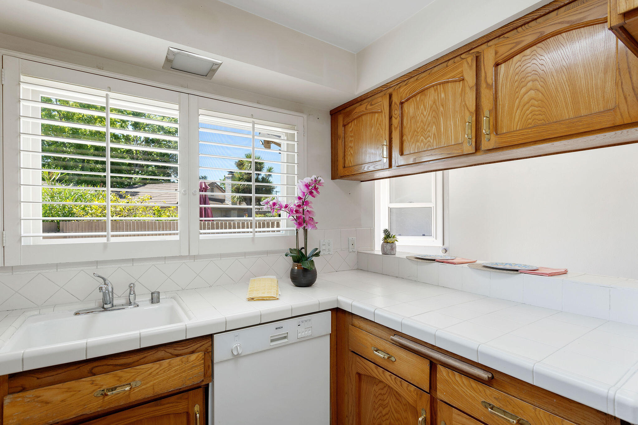 5822 Encina Road, Unit 2 Santa Barbara, CA 93117 - Photo 4 of 42 a kitchen with stainless steel appliances sink cabinets and window