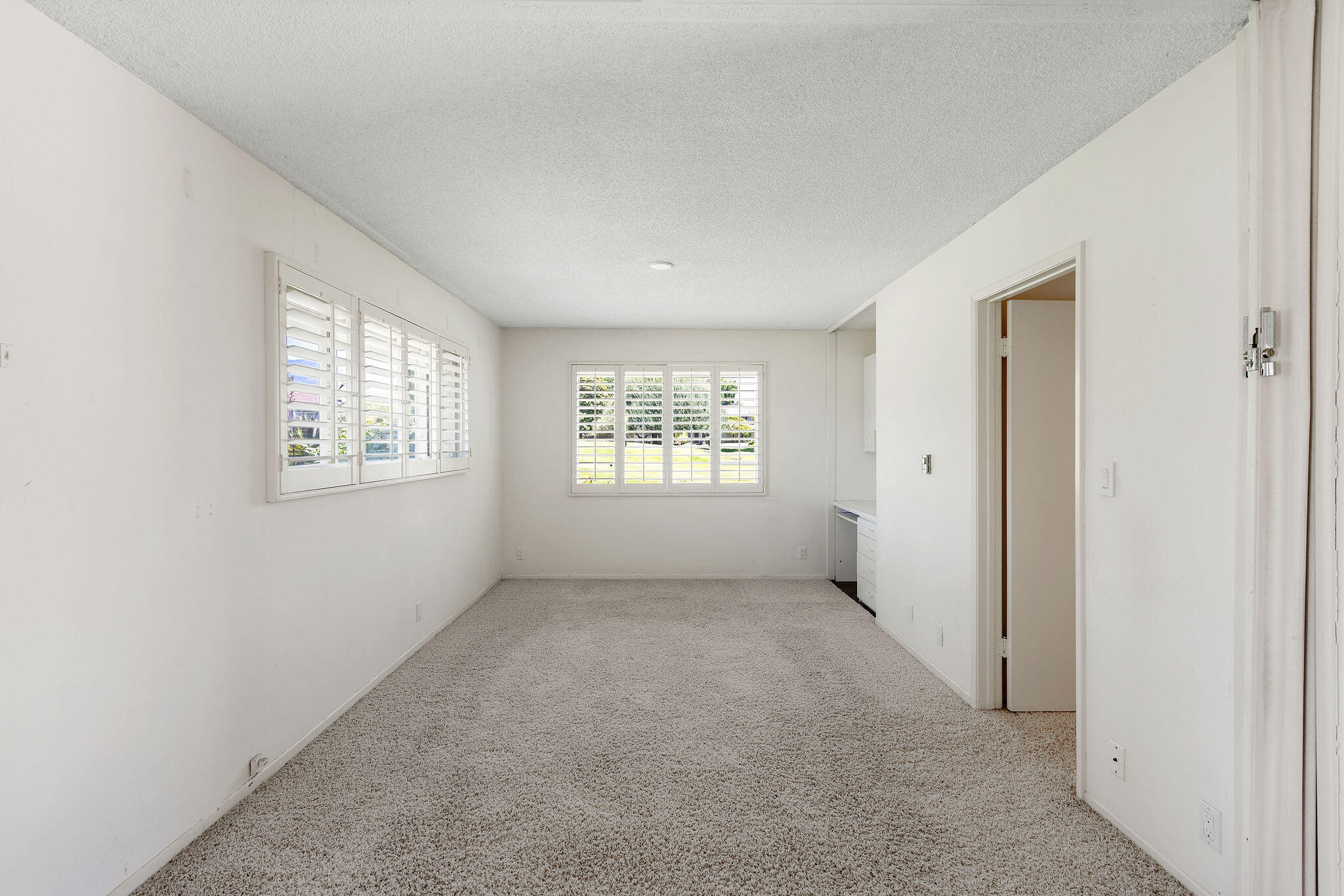 5822 Encina Road, Unit 2 Santa Barbara, CA 93117 - Photo 7 of 42 an empty room with windows and closet