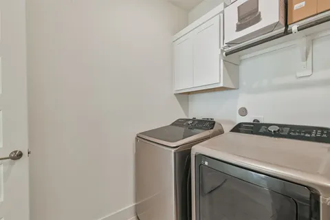 a bedroom with a bed and dresser