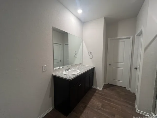 a bathroom with a sink and mirror