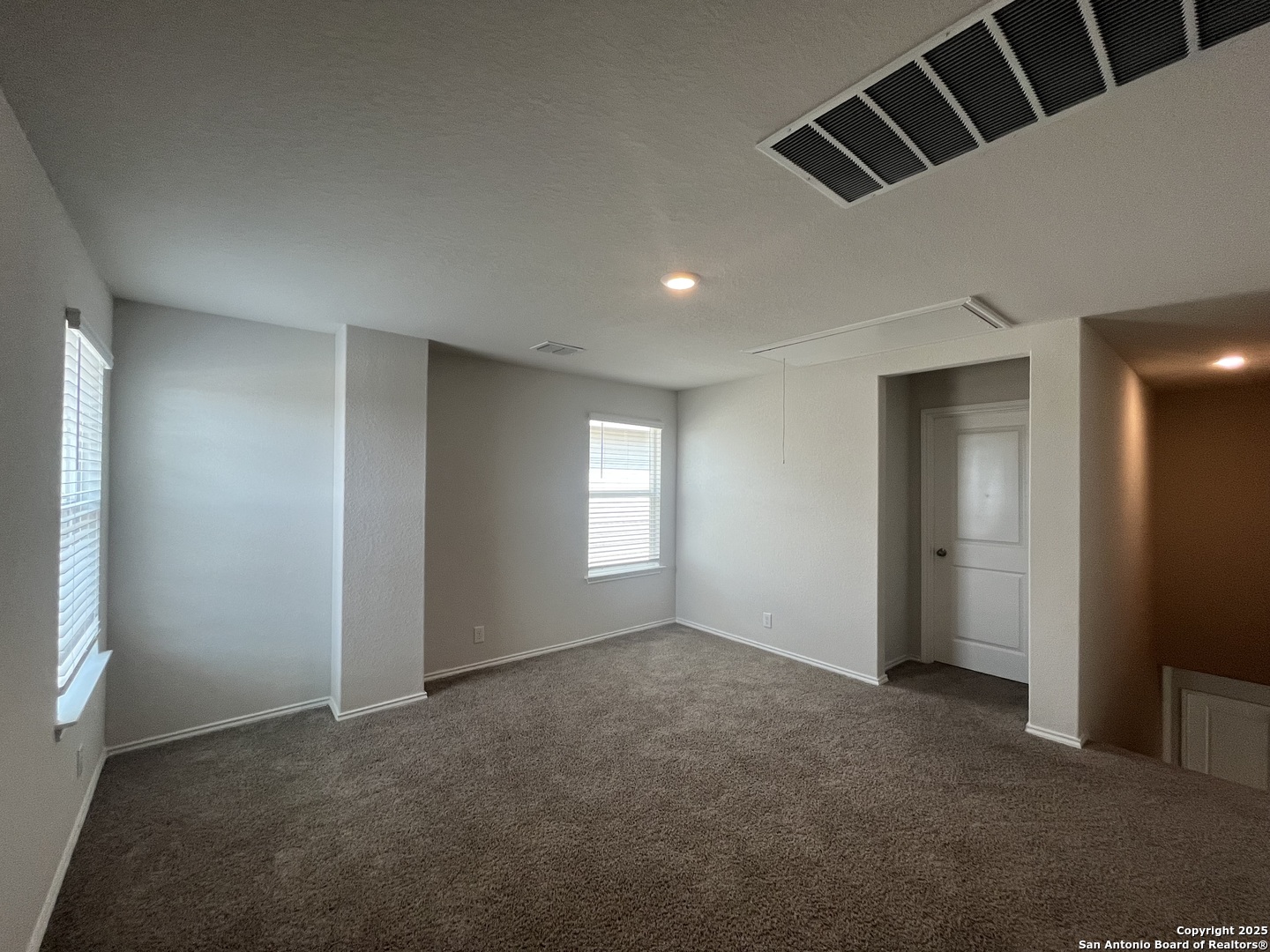 141 Middle Grn Loop Floresville, TX 78114 - Photo 18 of 29 a view of an empty room with a window