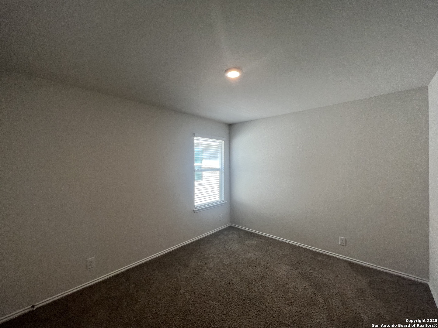 141 Middle Grn Loop Floresville, TX 78114 - Photo 21 of 29 an empty room with windows