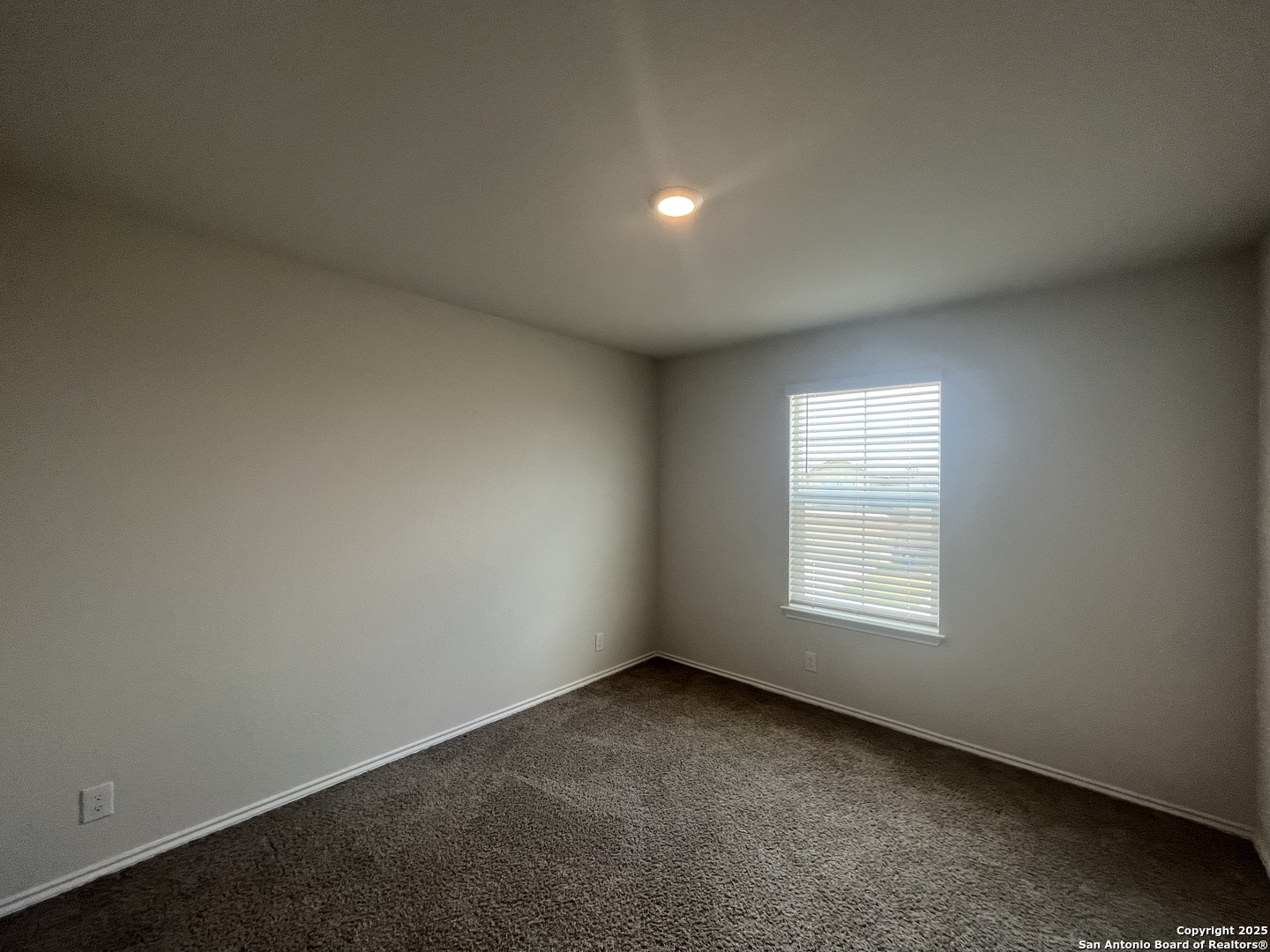 141 Middle Grn Loop Floresville, TX 78114 - Photo 24 of 29 an empty room with a window