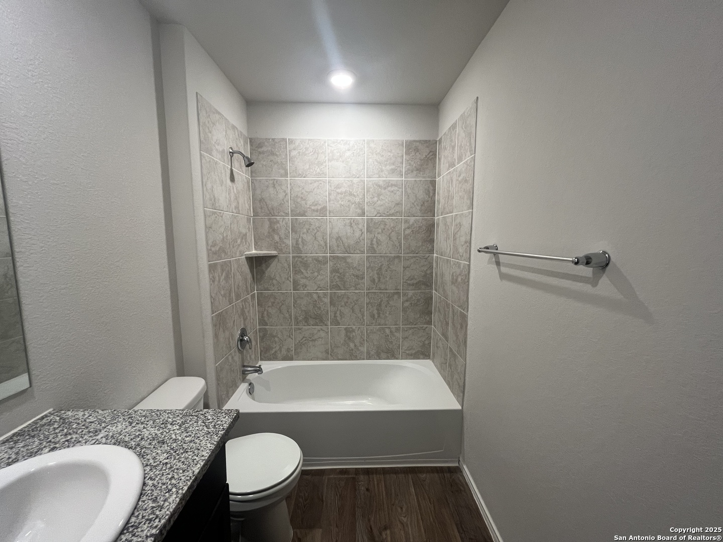 141 Middle Grn Loop Floresville, TX 78114 - Photo 28 of 29 a bathroom with a granite countertop sink toilet and shower