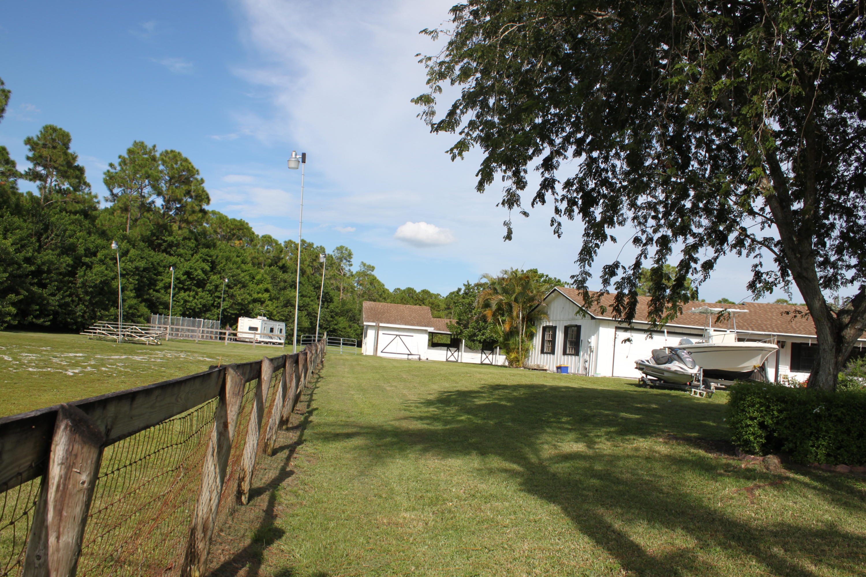 3840 Dellwood Road Loxahatchee, FL 33470 - Photo 18 of 60 a view of a town with large trees