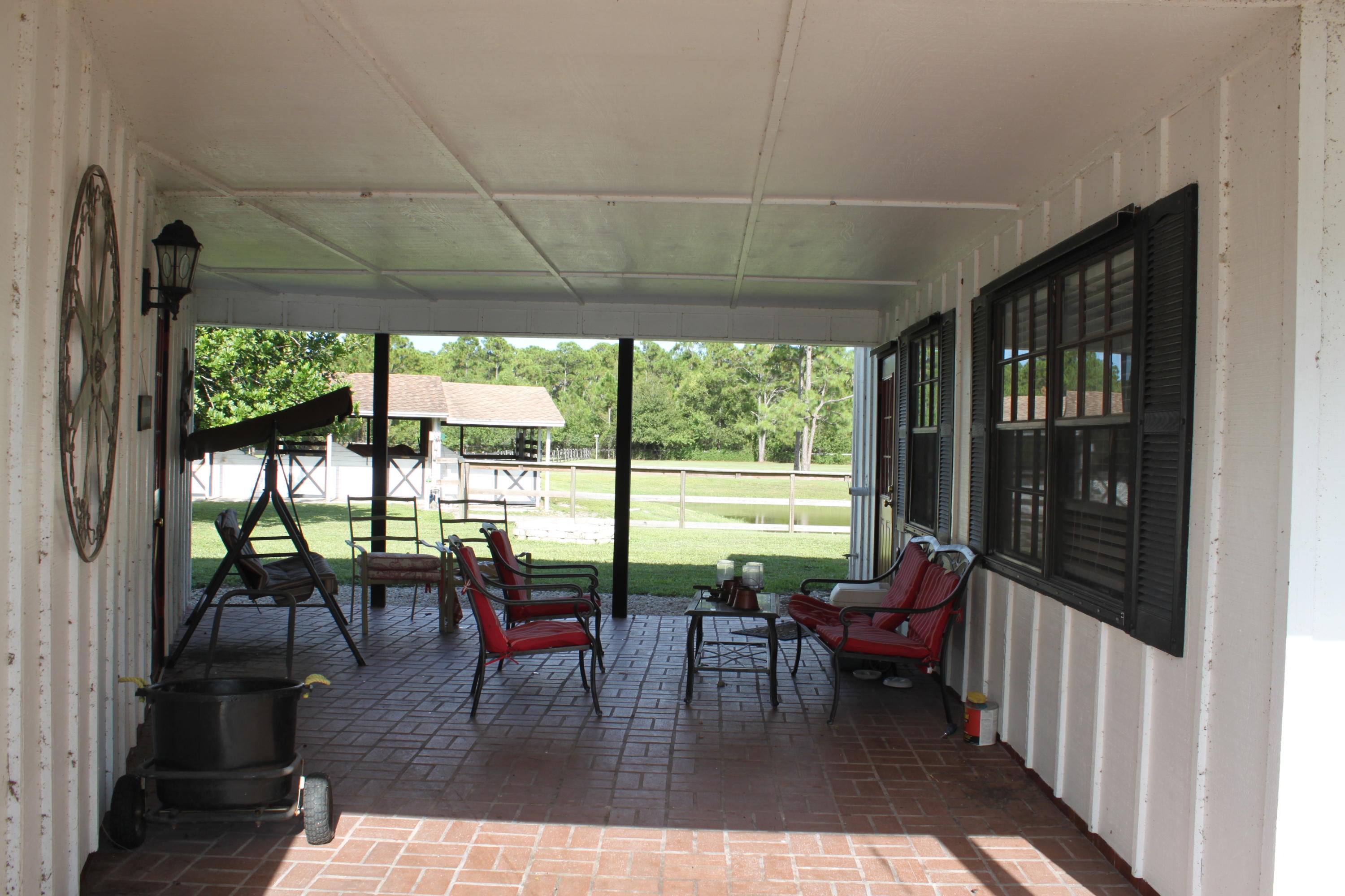 3840 Dellwood Road Loxahatchee, FL 33470 - Photo 30 of 60 a view of a dining room with furniture window and outside view