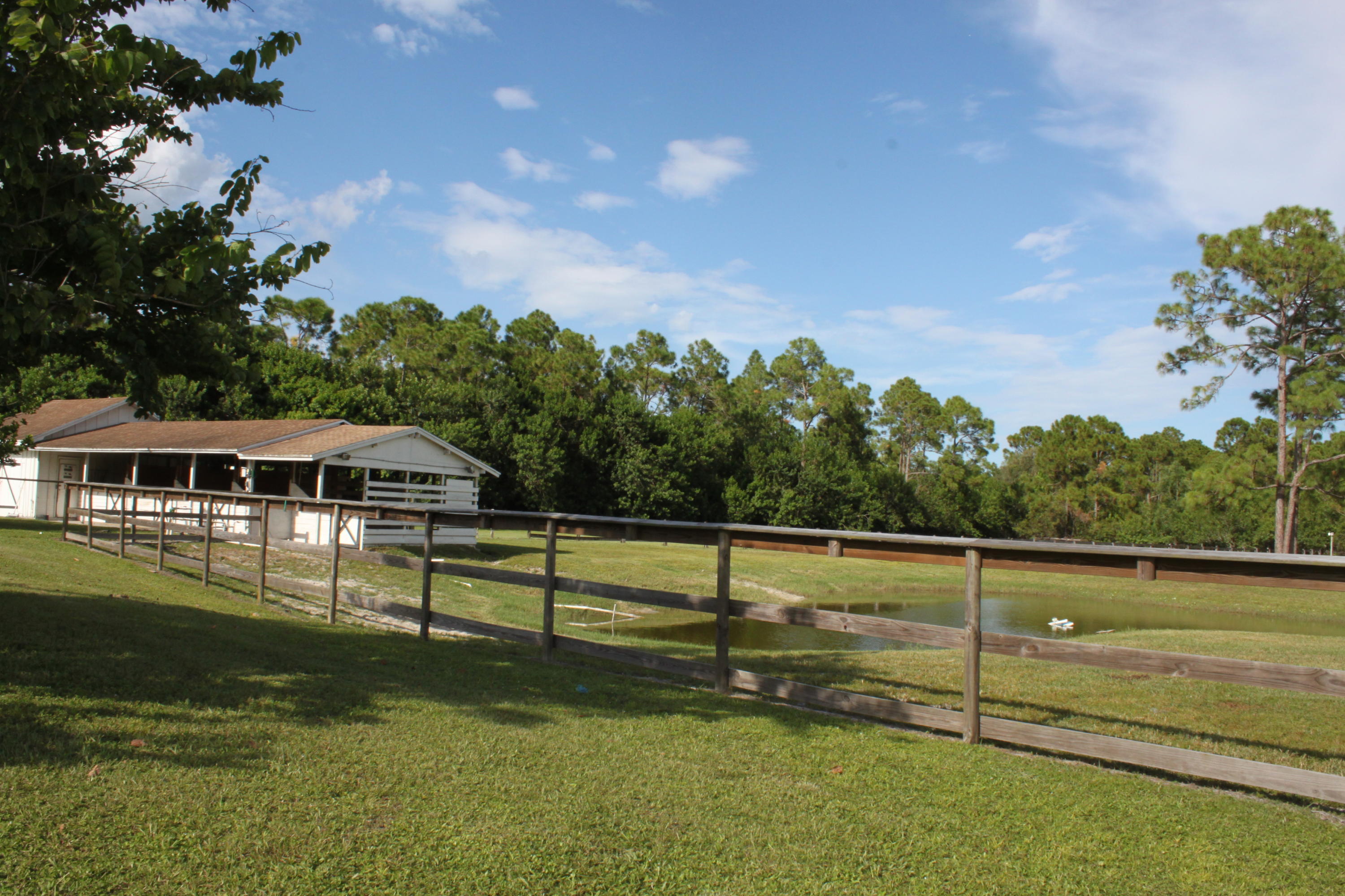 3840 Dellwood Road Loxahatchee, FL 33470 - Photo 34 of 60 a view of a house with a yard