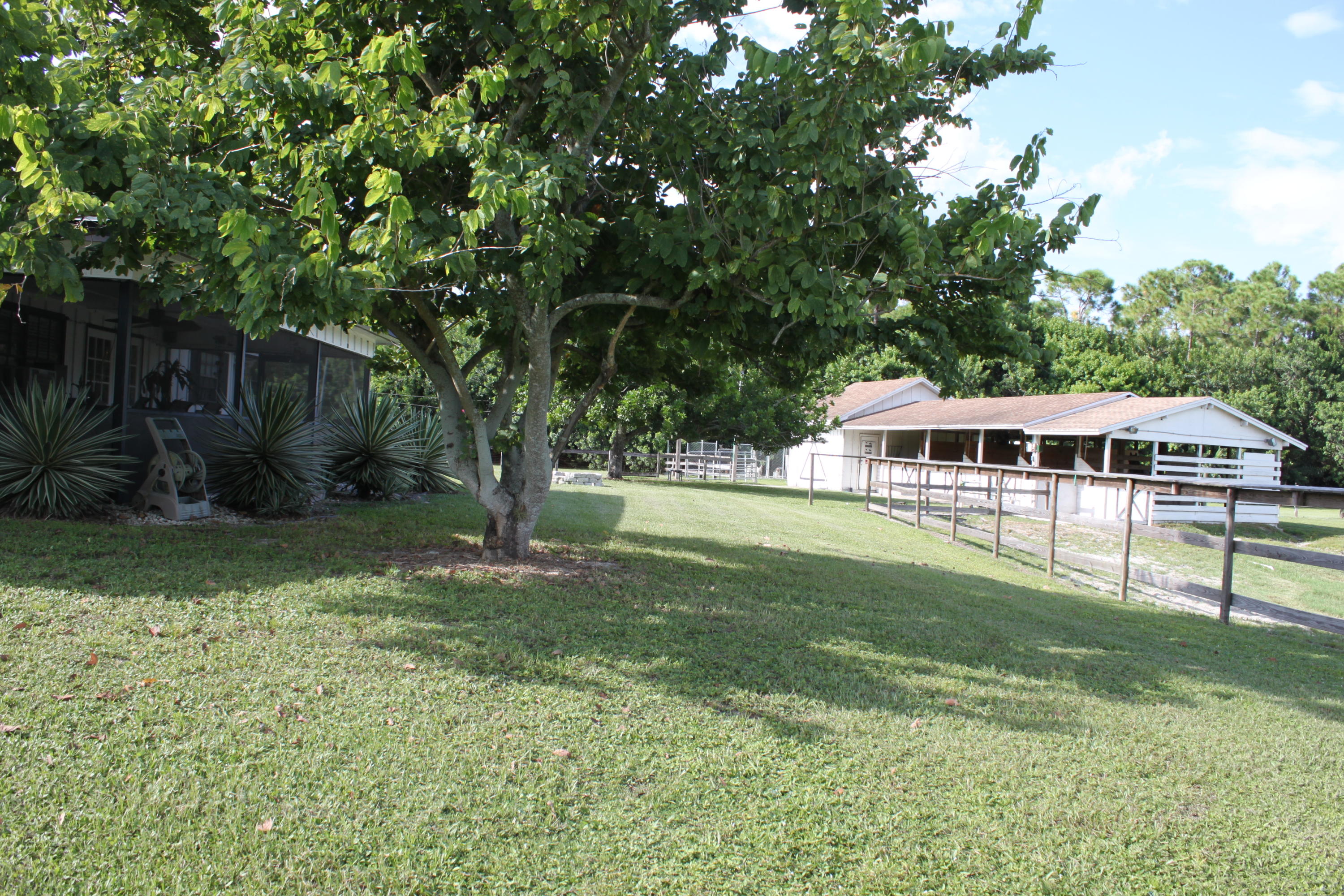 3840 Dellwood Road Loxahatchee, FL 33470 - Photo 36 of 60 a view of a house with a yard
