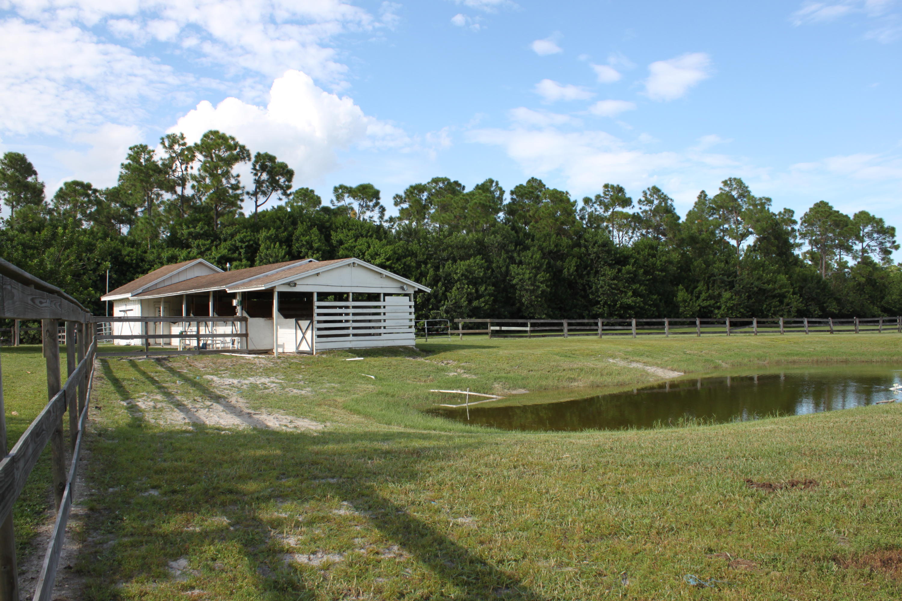 3840 Dellwood Road Loxahatchee, FL 33470 - Photo 40 of 60 a view of a house with a yard