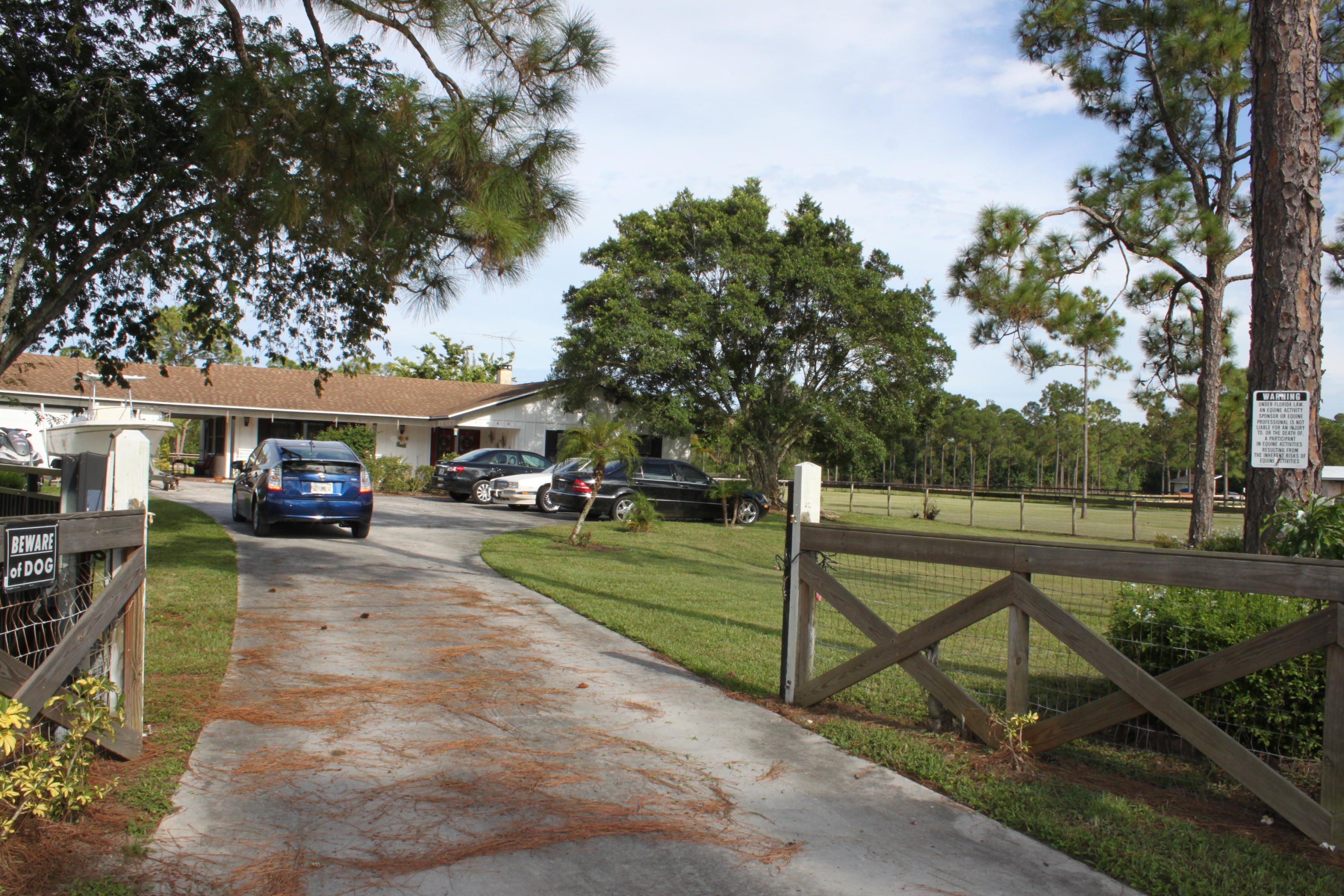 3840 Dellwood Road Loxahatchee, FL 33470 - Photo 5 of 60 a view of a park with bench and a slide