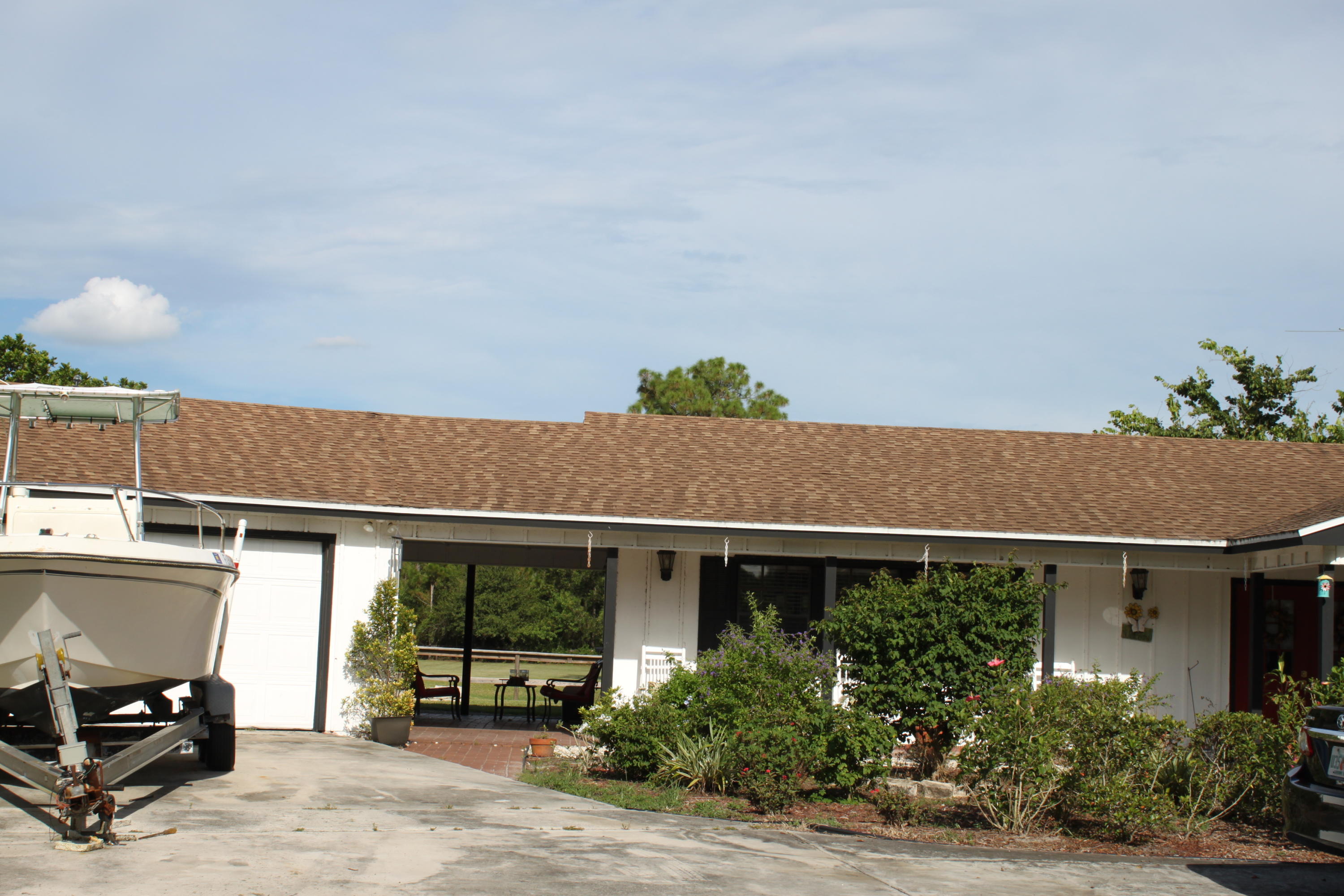 3840 Dellwood Road Loxahatchee, FL 33470 - Photo 9 of 60 a view of house and car parked