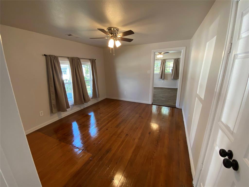 810 Greenville Road McKinney, TX 75069 - Photo 6 of 21 a view of a hallway with wooden floor and staircase