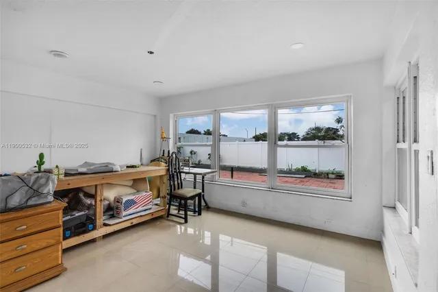 a room with a bed and a desk in it