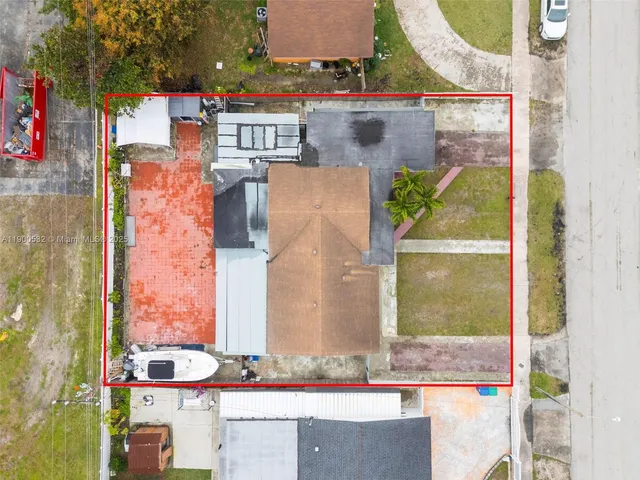 an aerial view of residential houses with outdoor space