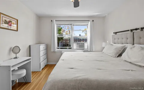 a bedroom with a bed and chair