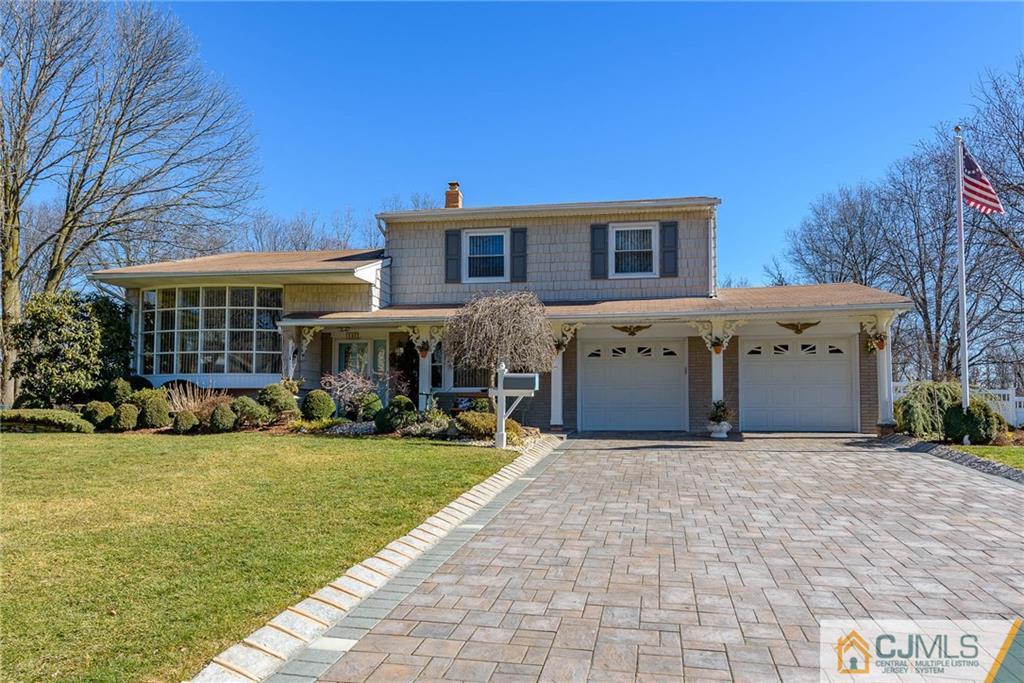 141 Devon Road Colonia, NJ 07067 - Photo 1 of 25 a view of a house with a yard and sitting area