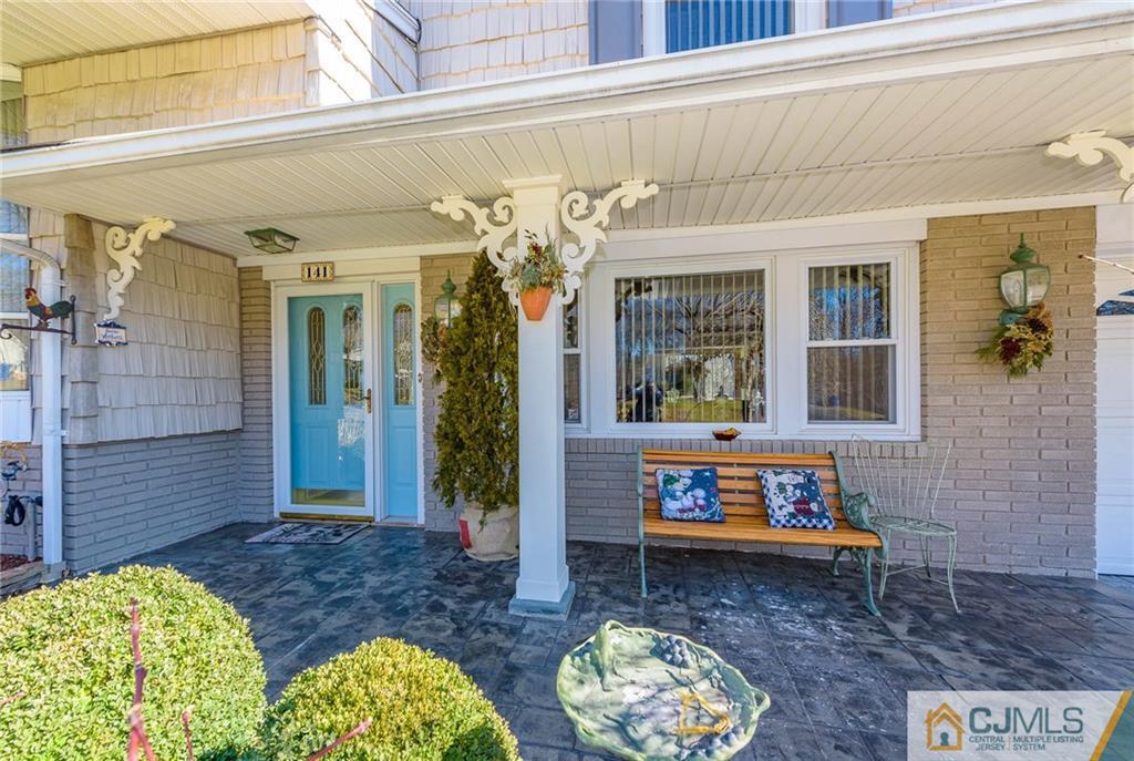 141 Devon Road Colonia, NJ 07067 - Photo 2 of 25 a front view of a house with garden
