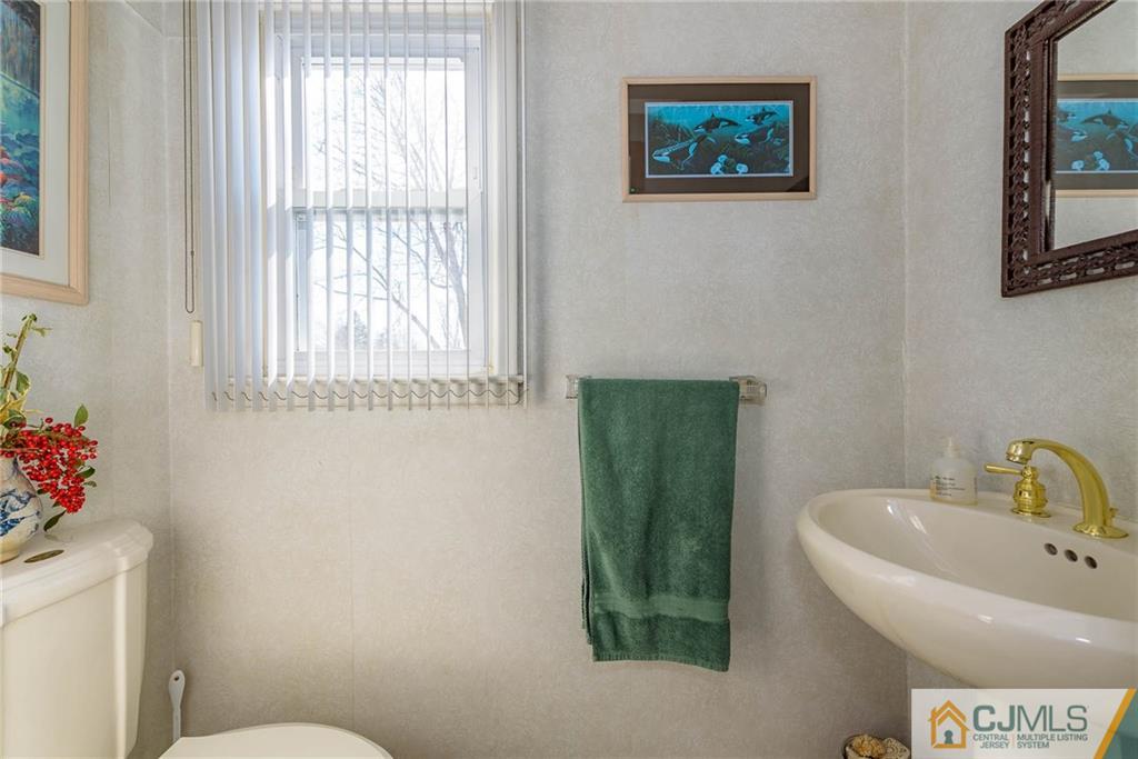 141 Devon Road Colonia, NJ 07067 - Photo 21 of 25 a bathroom with a toilet and a sink
