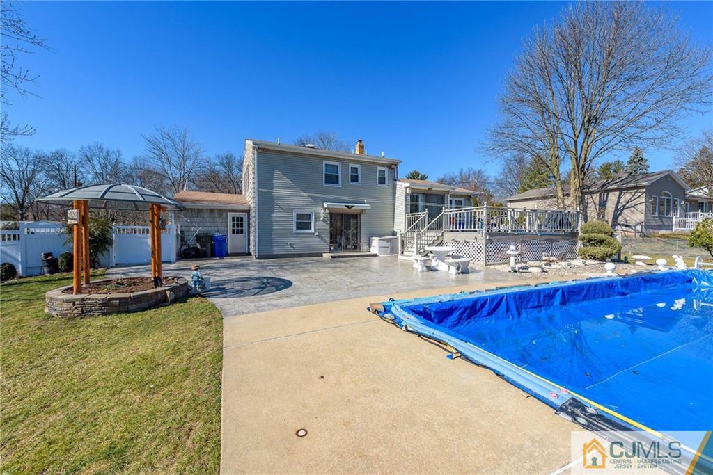 141 Devon Road Colonia, NJ 07067 - Photo 23 of 25 a view of a house with swimming pool