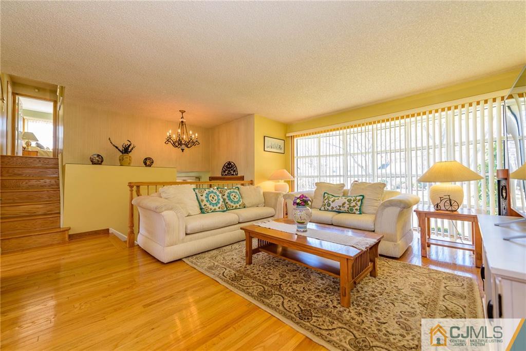 141 Devon Road Colonia, NJ 07067 - Photo 6 of 25 a living room with furniture and a rug