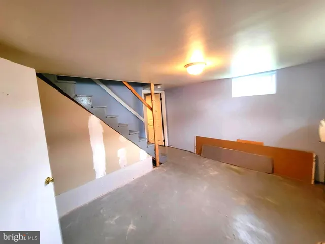 a view of an empty room with stairs