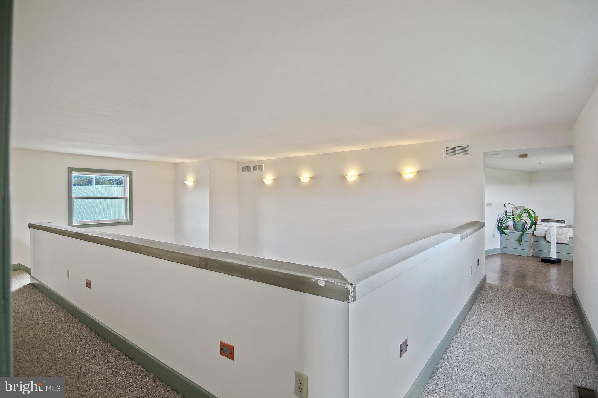 493 Hill Road Hegins, PA 17938 - Photo 19 of 46 Master suite catwalk from bedroom to bathroom.