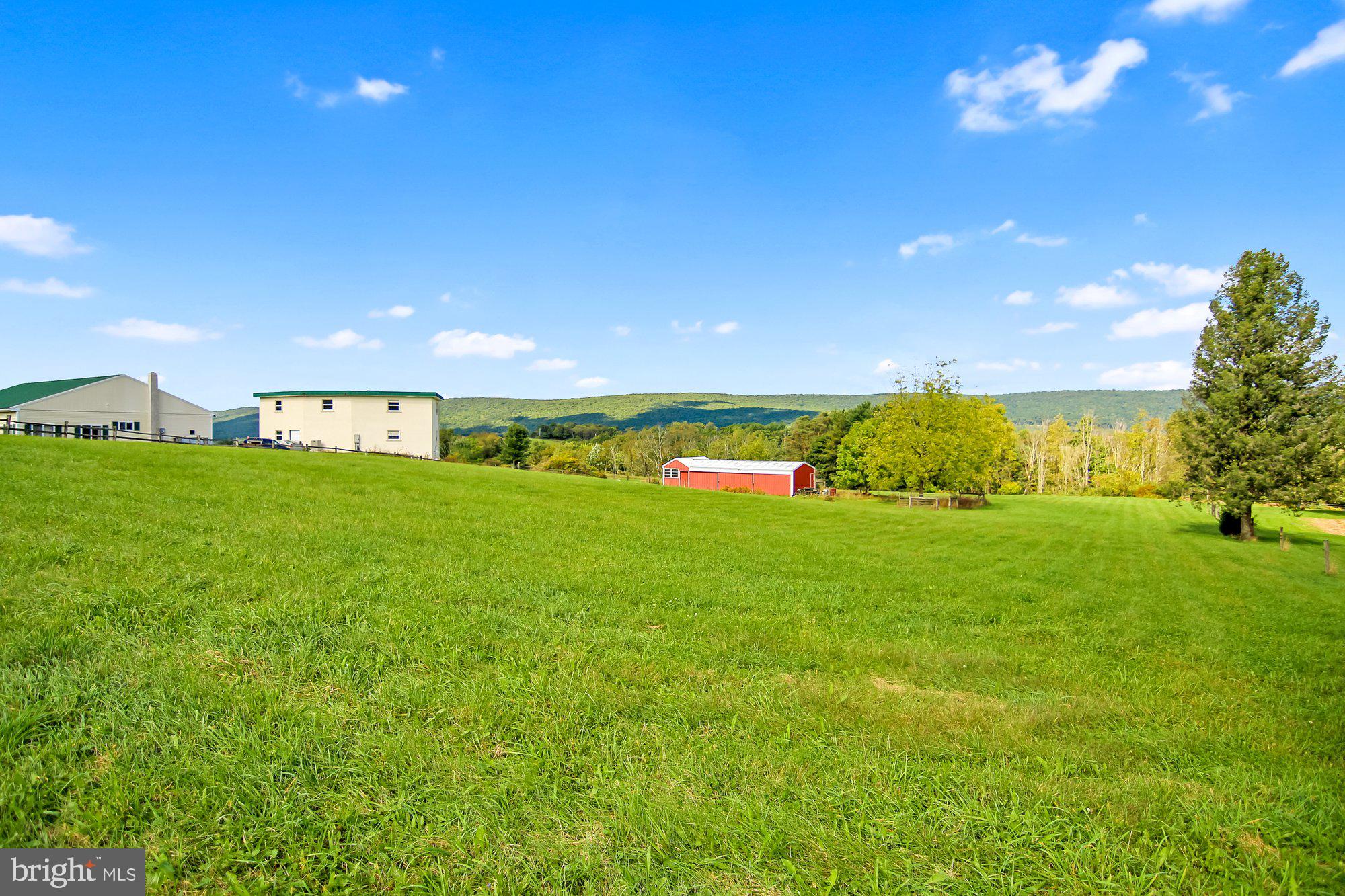 493 Hill Road Hegins, PA 17938 - Photo 2 of 46 Cresting view of home, garage and stable/barn.