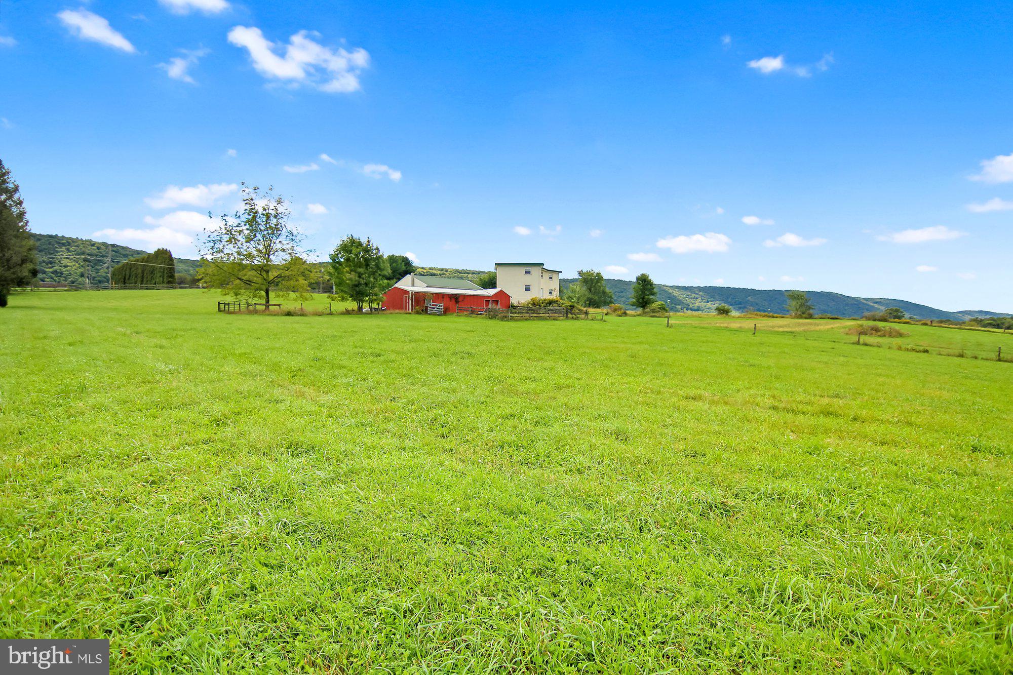 493 Hill Road Hegins, PA 17938 - Photo 45 of 46 Side view of home and stable in the pasture area.