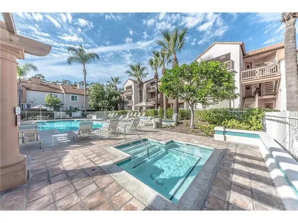 a view of a backyard with sitting area