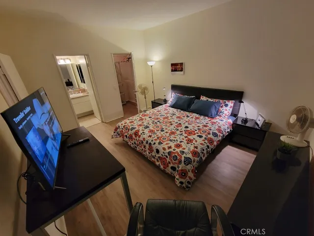 a bedroom with a bed and furniture