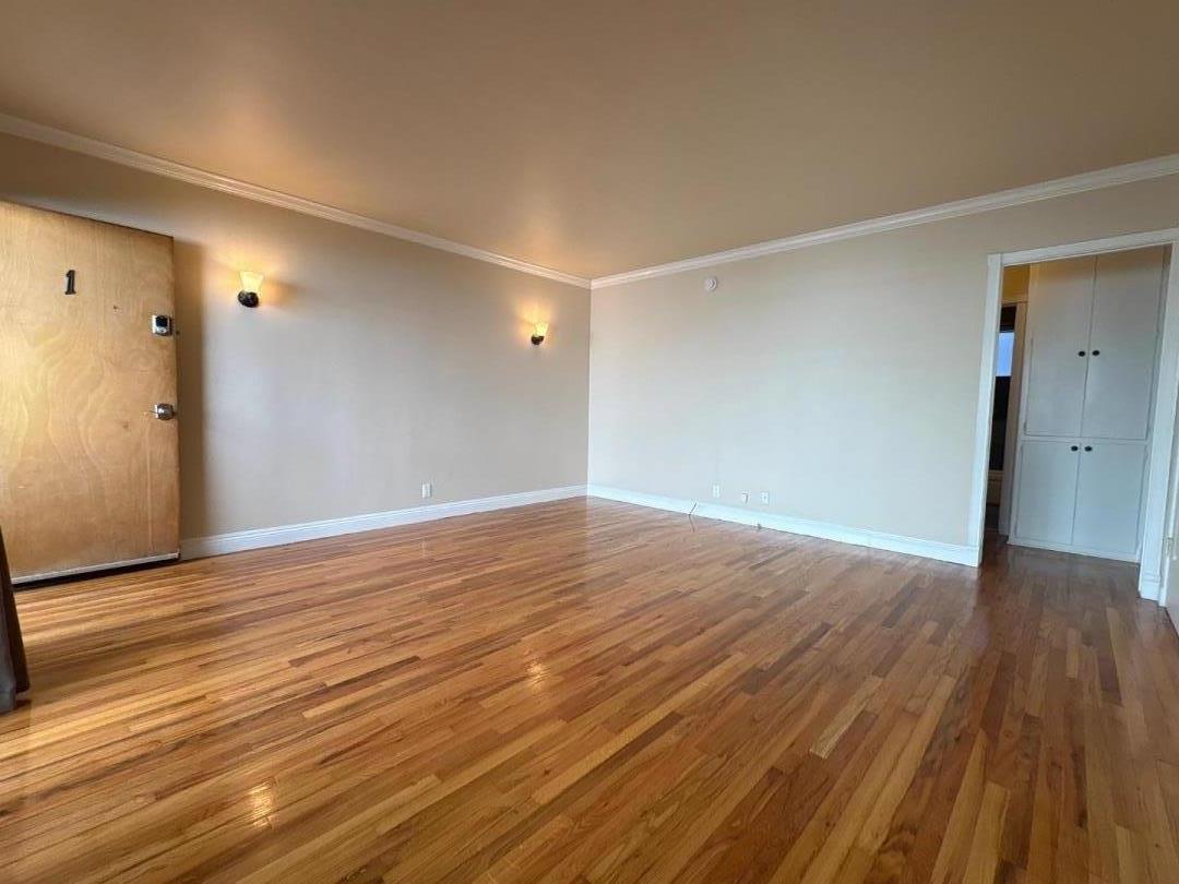 11719 Mayfield Avenue, Unit 1 Los Angeles, CA 90049 - Photo 12 of 28 a view of an empty room with wooden floor
