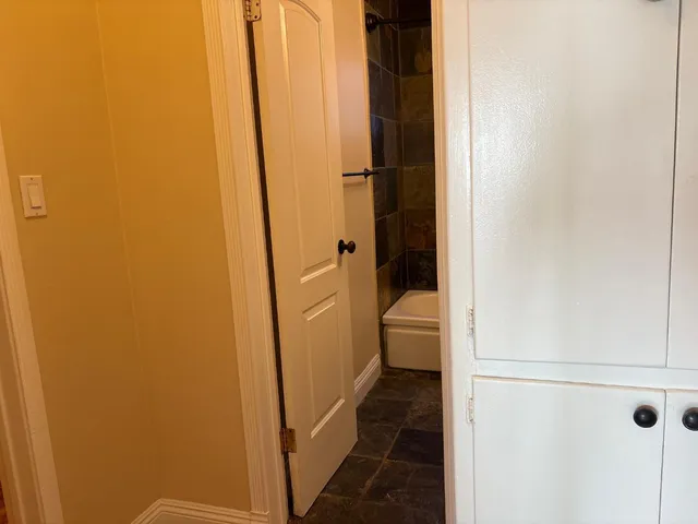 a bathroom with a granite countertop sink