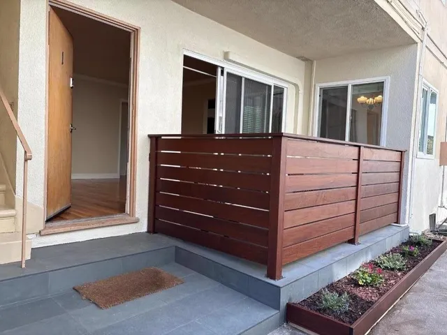 a view of walk in closet and bedroom