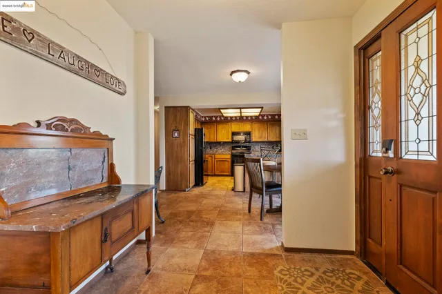 a view of a dining room with furniture and chandelier
