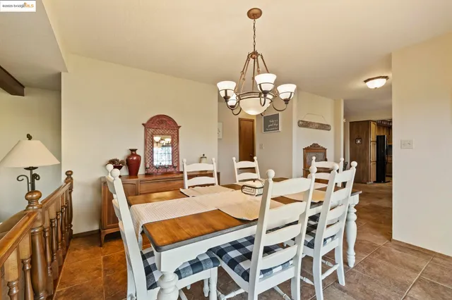a living room with fireplace furniture and a large window