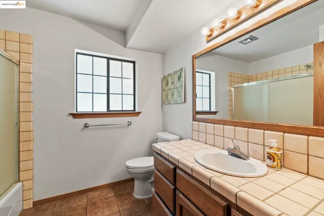 a view of a storage and utility room with racks on the wall