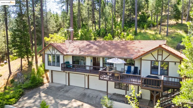 a house view with a sitting space and garden