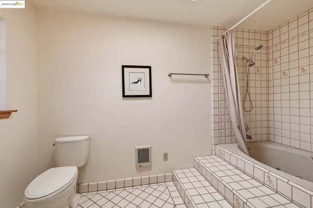 a bedroom with a bed and a cabinets