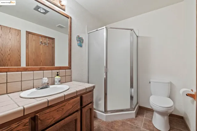 a view of a livingroom with furniture and a window