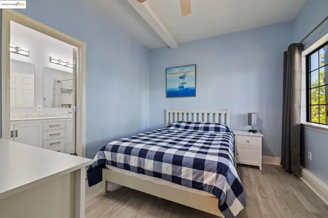 a view of a porch with a table and chairs and floor to ceiling window