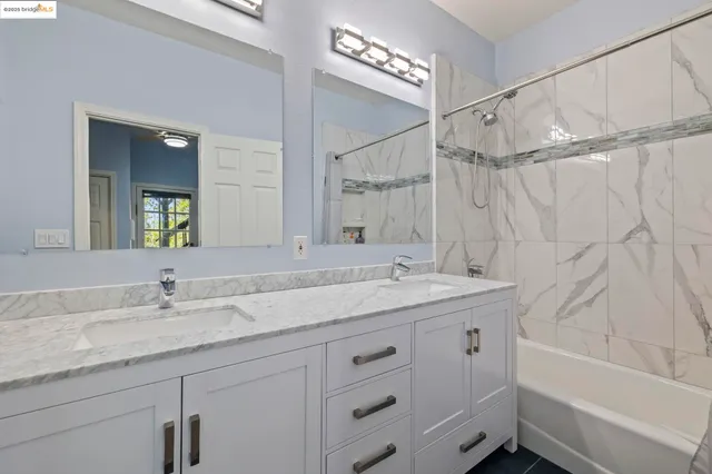 a view of a table and chairs under an umbrella