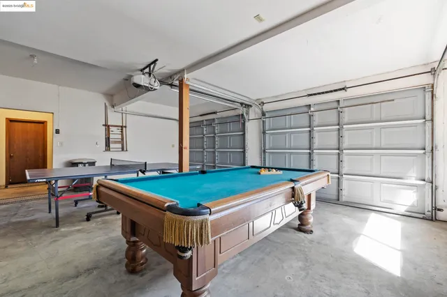 an aerial view of lake and residential houses with outdoor space