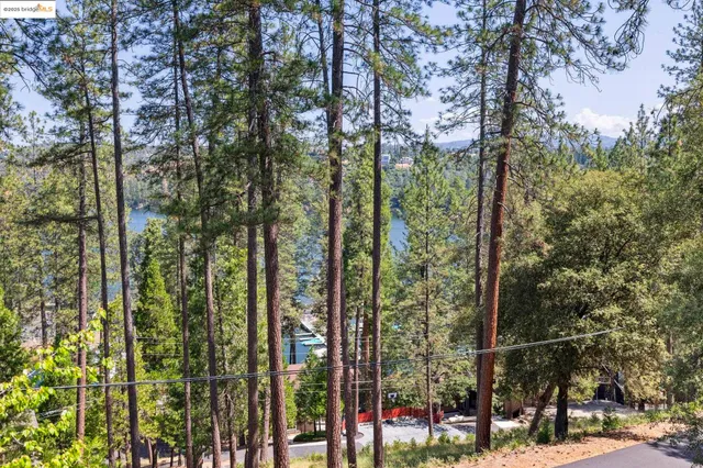 a view of deck with furniture and umbrella