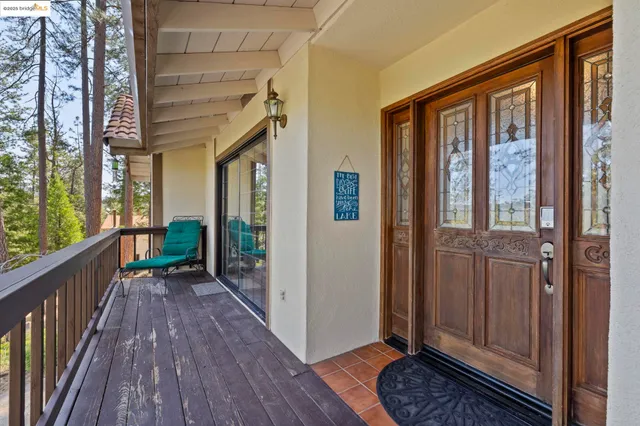 a dining room with furniture and a window